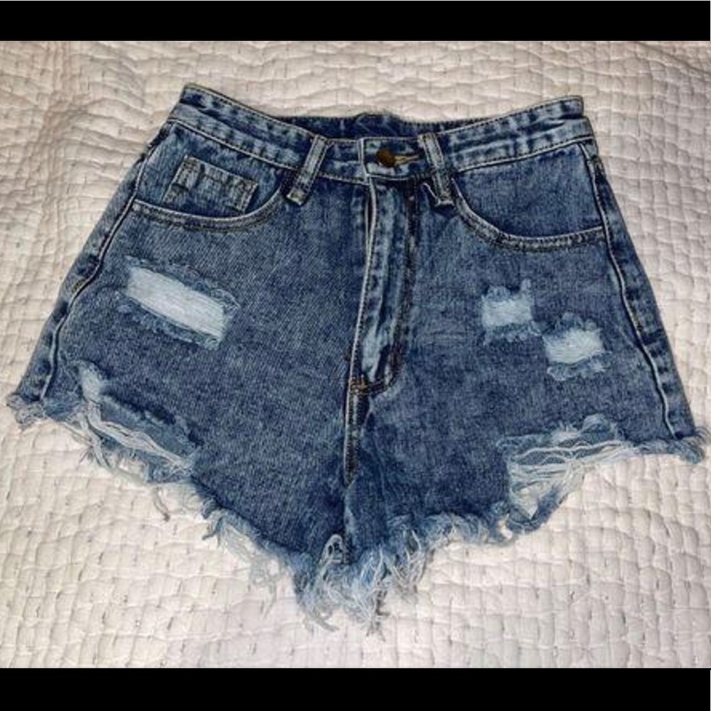 Ripped blue jean shorts